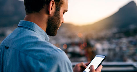 Channel marketer looking at his phone